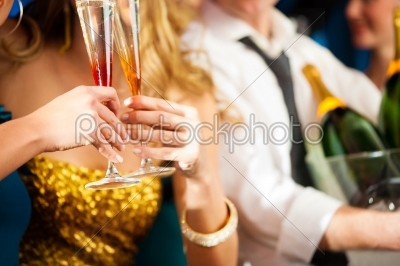 Couple with Champagner in club or party
