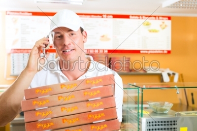 Delivery service - man holding pizza boxes
