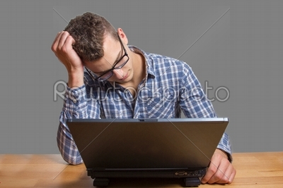 Desperate Man sitting at the Computer