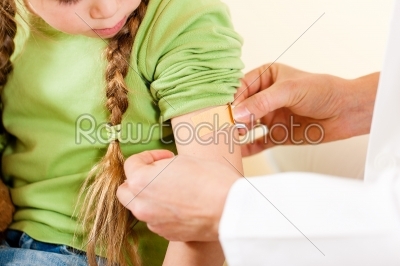 doctor applying bandage - Pediatrician
