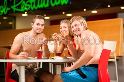 Eating in restaurant at public swimming pool