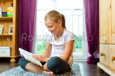 Family - child or teenager reading a book