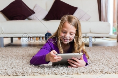 Family - child playing with Tablet computer pad