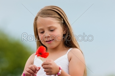 Family - Happy girl with corn poppy