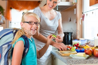 Family - mother making breakfast for school