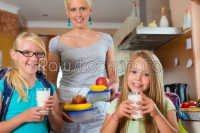 Family - mother making breakfast for school