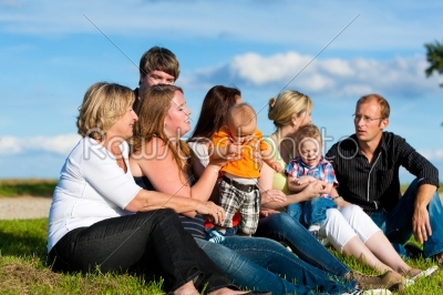 Family and multi-generation - fun on meadow in summer