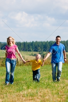 Family having walk on meadow 