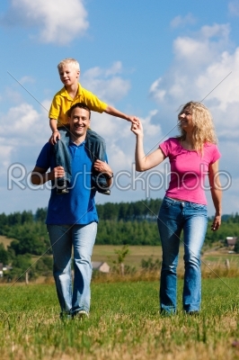 Family having walk on meadow 