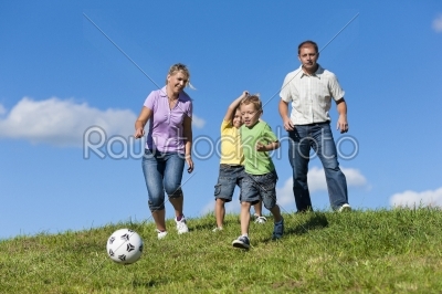 Family is playing soccer