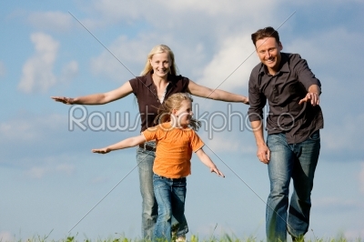 Family playing at a walk
