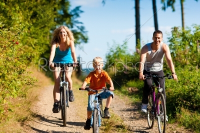 Family riding bicycles for sport