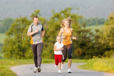 Family running for sport outdoors