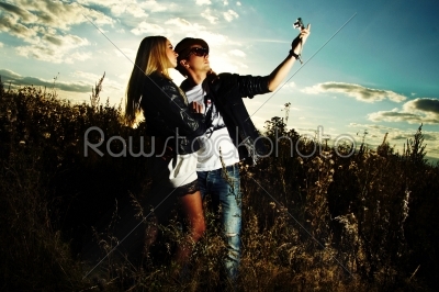Fashion man and woman in field