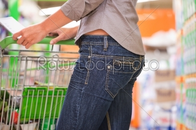 Fashionable Woman Shopping with Trolley