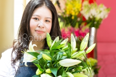 Female Florist holding a Bouquet
