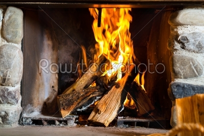 Fireplace in a hunter_qt_s cabin or alpine hut