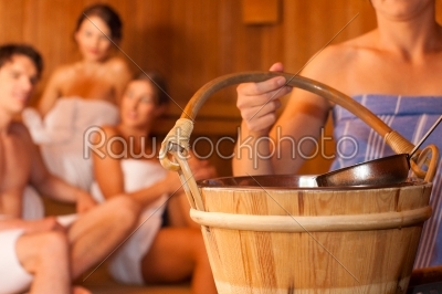 Four friends in sauna of a thermal bath