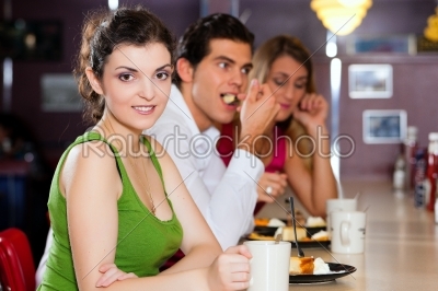 Friends in Restaurant eating and drinking