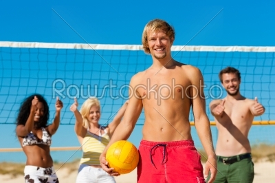 Friends playing Beach volleyball