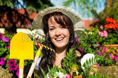 Gardening in summer - woman with flowers