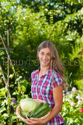 Gardening in summer - woman with vegetables