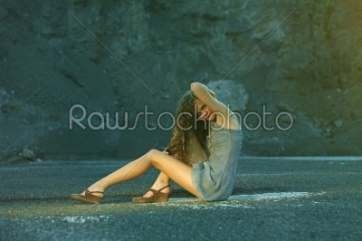 Girl fashion posing on a rock