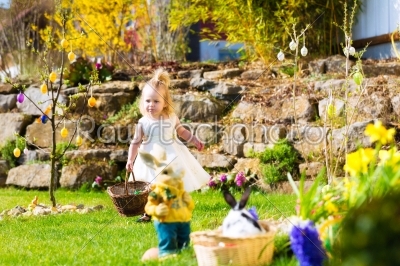 Girl on Easter egg hunt with eggs