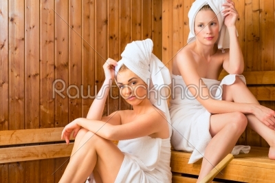 Girlfriends in wellness spa enjoying sauna infusion