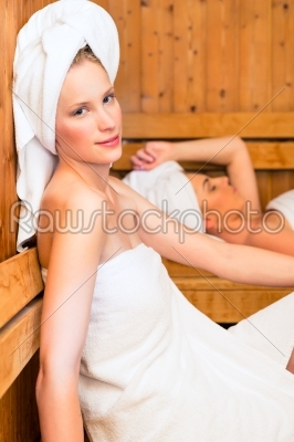 Girlfriends in wellness spa enjoying sauna infusion