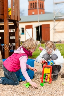 Girls playing on the playground having fun