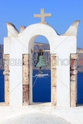 Greek orthodox church with Ferry boat in Santorini