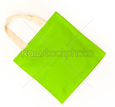 Green cotton bag on white isolated background. 