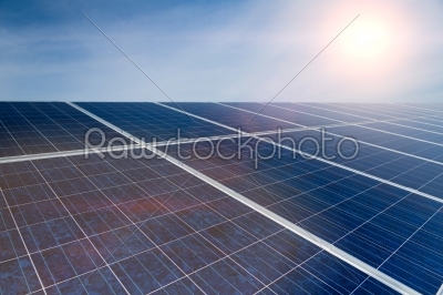 Green Energy - Solar panels with blue sky