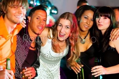 Group of friends in nightclub drinking