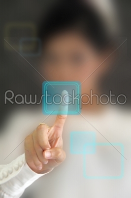 Hand pressing virtual button on futuristic holographic screen. 