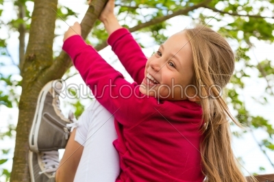 Happy child playing in the garden