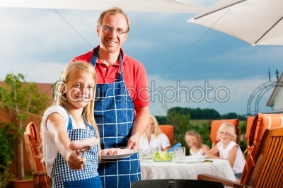 Happy family having a barbecue