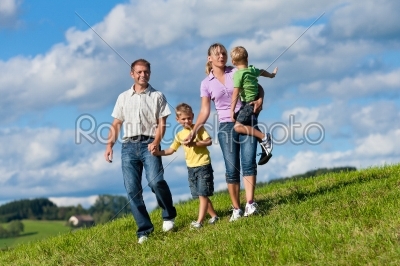 Happy family in summer on a walk