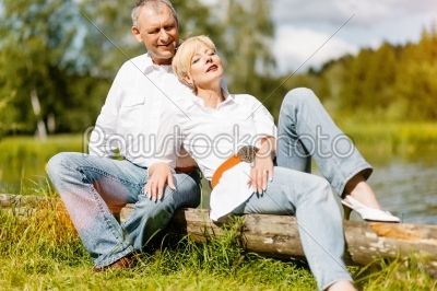 Happy senior couple outdoors in spring