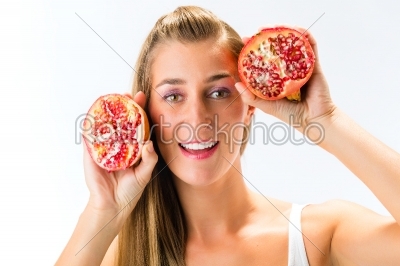 Healthy eating - woman with pomegranate