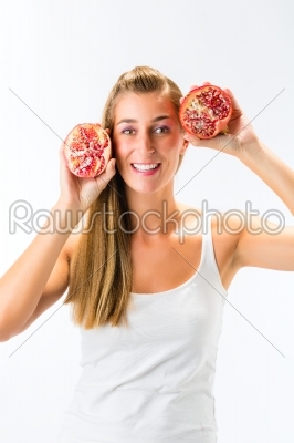 Healthy eating - woman with pomegranate