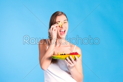 Healthy nutrition - young woman with fruits