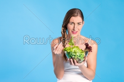 Healthy nutrition - young woman with salad