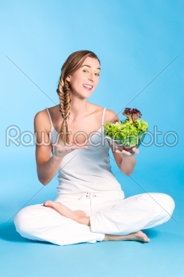 Healthy nutrition - young woman with salad