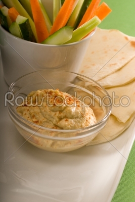 hummus dip with pita bread and vegetable