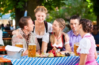 In Beer garden - friends on a table with beer