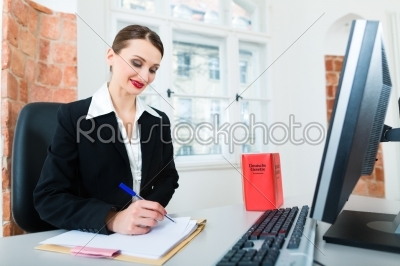 Lawyer in office sitting on the computer 