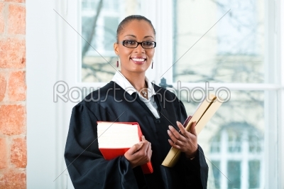 Lawyer in office with law book and Dossier
