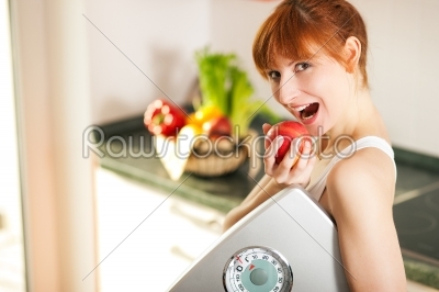 loosing weight - woman with scale and apple